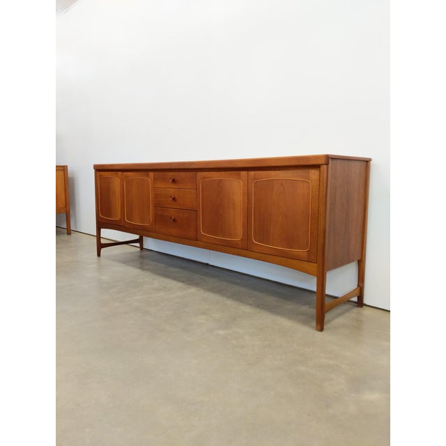 Authentic vintage mid century modern teak credenza / sideboard / console. By Nathan Furniture (unmarked). This piece is in...