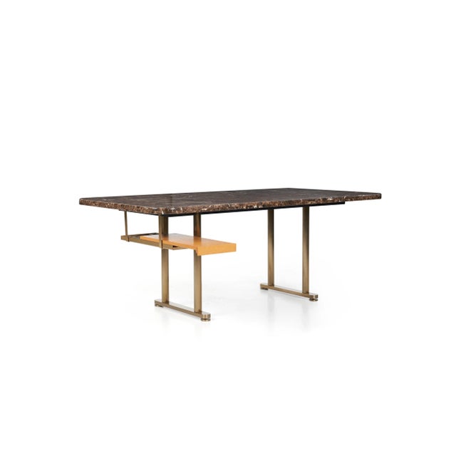 Zogrophos desk, slab of dark Emperador marble (brown with white veining). Polished bronze uprights, legs have self...