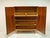 Elegant vintage hall cabinet from the 1960s with high-quality walnut and makoré veneer. The warm wood tones, polished...