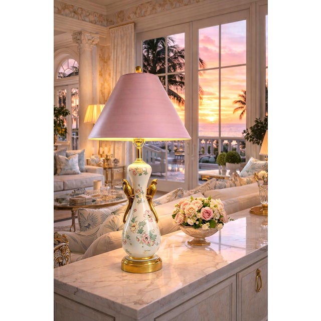 Offering and outstanding restored 1940s Art Nouveau porcelain ceramic table lamp with a pair of metallic gold glazed three...