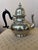 This is a vintage 1980s Kirk Stieff "Old Annapolis" pewter teapot featuring a polished finish and a distinct black handle....