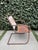 Mid-20th century cantilever patio chair featuring a sculptural pressed steel shell seat and tubular steel frame. The form...