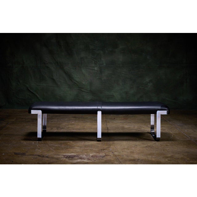 Trimark Furniture a backless bench with black leather upholstery and chrome-plated steel base. - It has a flat bar chrome-...