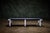 Trimark Furniture a backless bench with black leather upholstery and chrome-plated steel base. - It has a flat bar chrome-...