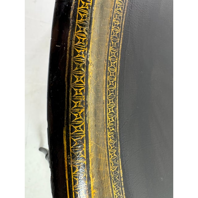 This is a late 19 century Regency inspired papier-mâché tray table. This table has a sophisticated delicate faux bamboo...