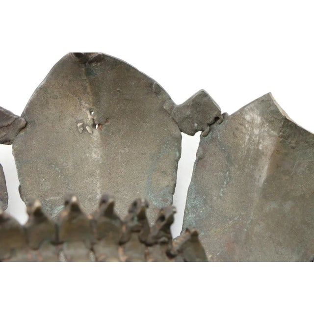 This bhuta mask represents either 'Jarandaya' or 'Jumadi', in a seemingly benevolent form with a fierce yet smiling...