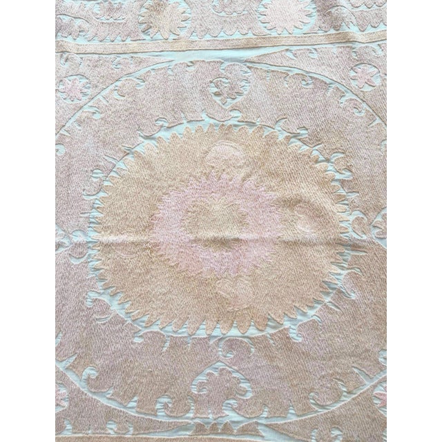 Vintage Suzani from Central Asian, circa 1960s era. There are stains on this suzani. Dimension; 52'' x 54'' inches / 132 x...