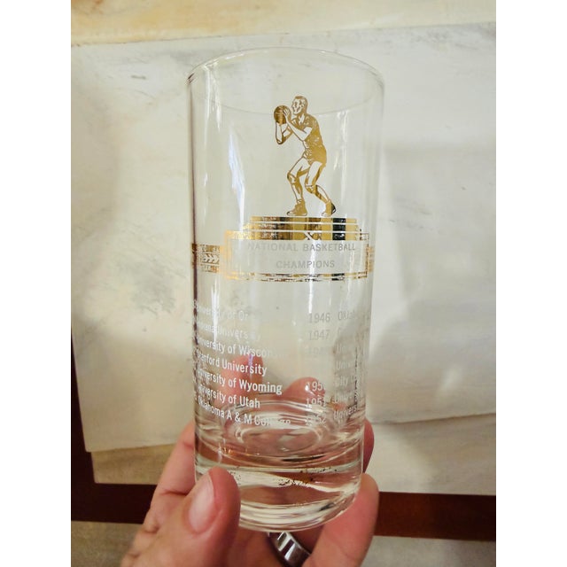 A striking set of five vintage Sport Kings highball glasses, produced in the 1950s, featuring elegant gold-printed trophy...