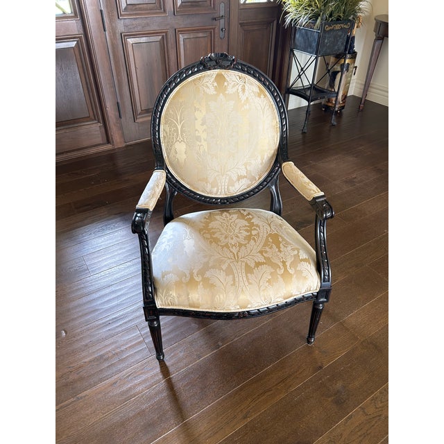 A beautifully crafted Louis XV style chair, embodying the graceful curves and refined ornamentation characteristic of...