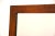 A mid century modern rosewood framed mirror. Comes with dresser mounting brackets