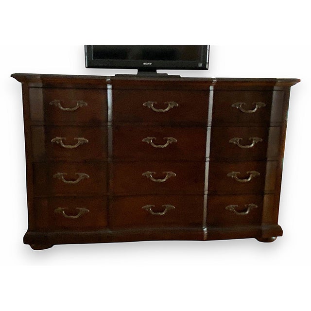 A luxuriously large Bernhardt dresser. In a serious dark red/brown color mix. Each drawer is very spacious. On metal...