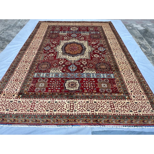 This exquisite hand-knotted wool area rug features a classic Meshhed design with an elegant traditional layout. The...