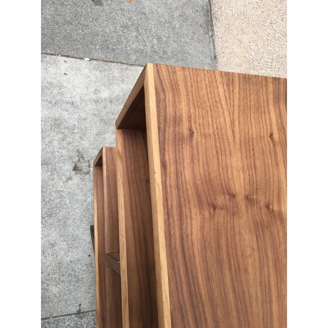 W72 D10 H32 Sharp and clean lines define this bookcase all in a gorgeous natural walnut tone. Handcrafted to thinner...
