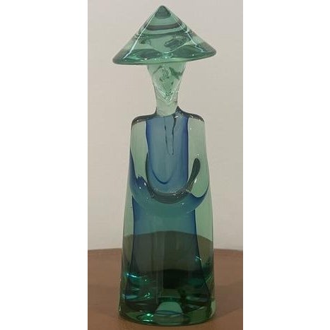 This sculpture is often described as a “Chinese Man” or “Chinese Farmer.” It was made in Murano, Italy, commonly in dark...
