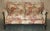 An exceptionally rare, museum-quality circa 1880 Victorian two-seat sofa by the legendary Howard & Sons—widely regarded as...