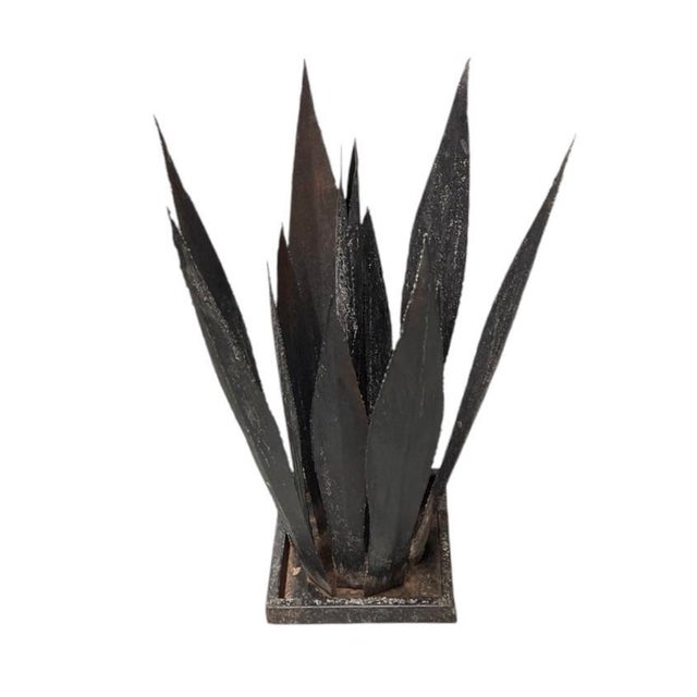 This striking vintage metal sculpture is a handcrafted interpretation of an agave plant, skillfully forged in Morocco. The...