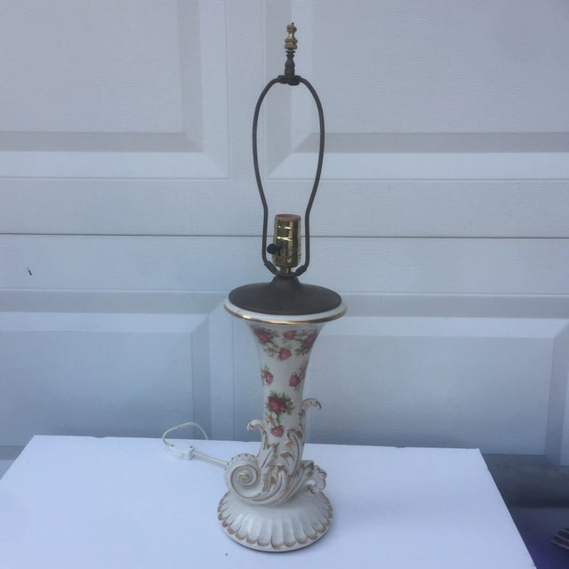 Beautiful vintage rose lamp with gold details and clicker. Base to socket is 17 inches.