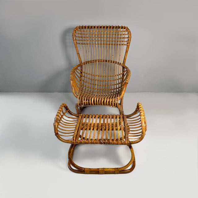 Italian Mid Century Modern rattan B4 armchair and pouf by Tito Agnoli, 1950s B4 armchair and pouf in finely woven rattan....