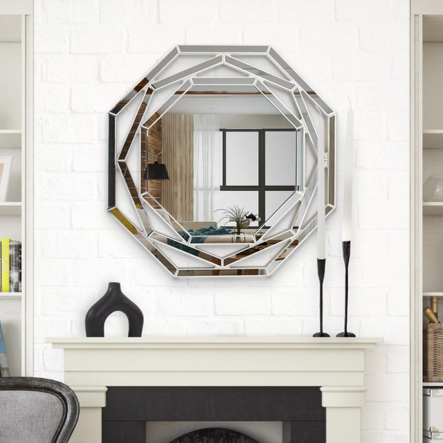 The Franklin Mirror showcases a mirror-on-mirror masterpiece with multiple angled pieces, each beveled to reflect light....
