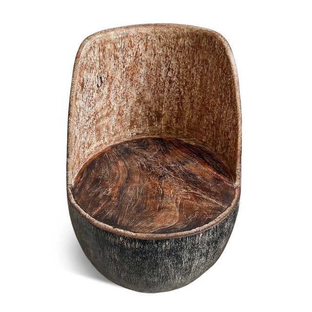 Solid coconut palm hand carved sculptural vintage chair. Celebrating the natural density and dramatic grain of the...