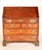 George III oak slant top desk, early 19th century. With a hinged slant top, interior of desk with central prospect door...