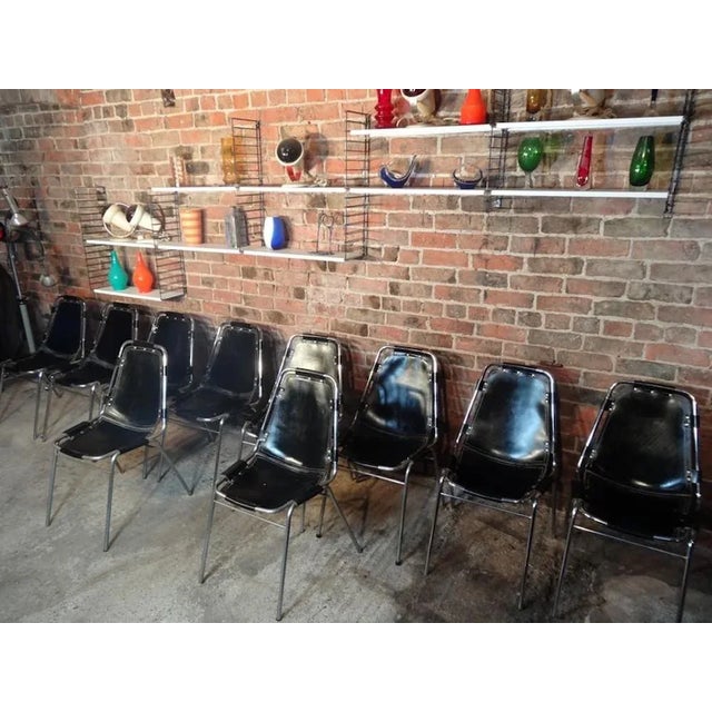 Stunning set of chairs, you will not find another set of 12 black leather chairs like this one on any web site worldwide!...