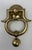 A large solid cast polished brass door knocker sophisticated in shape and design. A substantial Georgian style early...