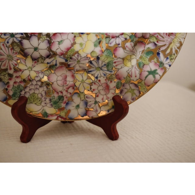 There is maximalism, and then there is the "Millefleur" effect. This striking 10-inch porcelain plate offers a dizzying,...