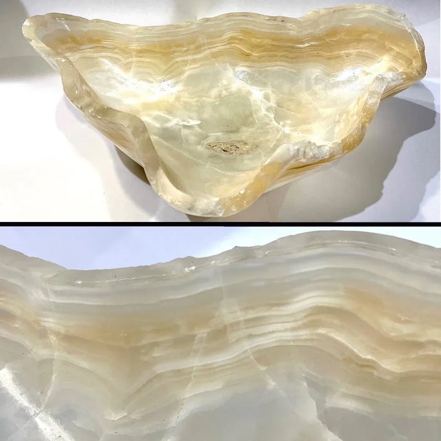 Carved out of a solid piece of onyx - this magnificent bowl is naturally amazing. Its sinuous free form shape inundates...