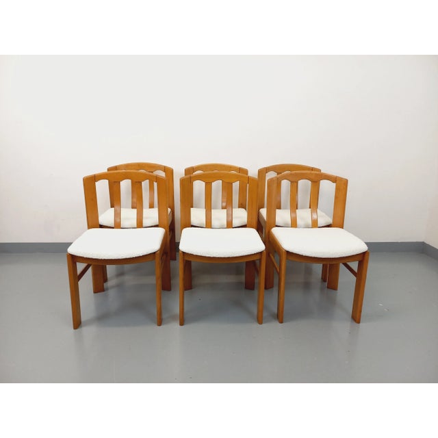 Six vintage chairs from the 1970s and 1980s, in the sleek yet imposing style of Baumann, Maison Regain, or Dyrlund. The...