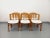Six vintage chairs from the 1970s and 1980s, in the sleek yet imposing style of Baumann, Maison Regain, or Dyrlund. The...