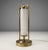 A compact Bauhaus-style table lamp produced in former Czechoslovakia during the 1930s. The design combines a tubular brass...
