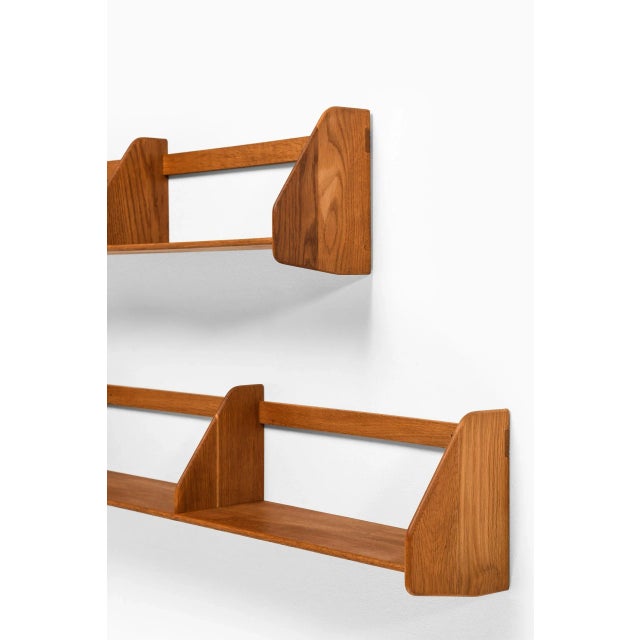 Wall mounted shelves designed by Hans Wegner. Produced by Ry Møbler in Denmark. This piece is attributed to the mentioned...