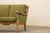 A beautiful 3-seater sofa resembling the style of Henning Henry Kjærnulf, forms a rare sculptural find. This sofa, crafted...