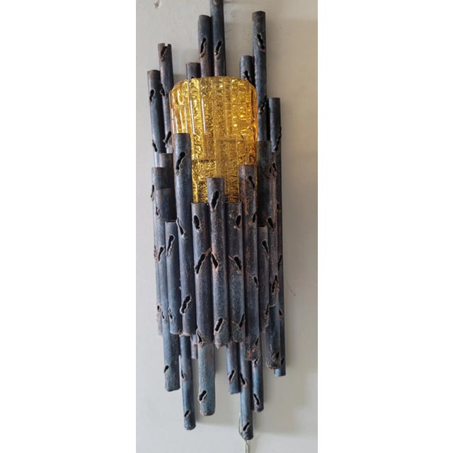 Brutalist wall lamp designed by the famous designer and artist Marcello Fantoni and produced in Italy. Beautiful torch-cut...