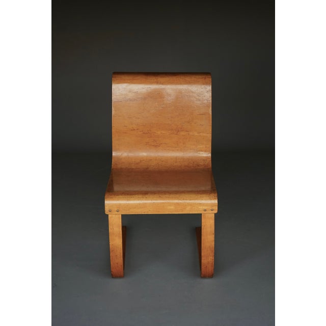 A rare model 21 cantilever chair with a karelian birch moulded plywood seat. Designed in 1933, this is a 1930s chair....