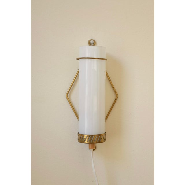Beautiful Finnish Mid-Century Glass and Brass Wall light by Maria Lindeman. Brass lamp arm that hangs off the wall with a...