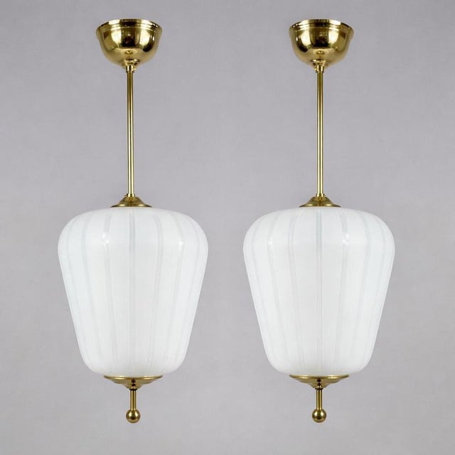 These elegant pendants were designed and manufactured in Sweden in the 1940s to 1950s. The lights feature elegant...