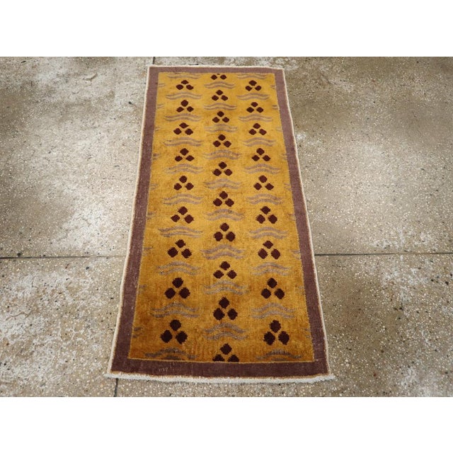 A vintage Turkish Anatolian Deco throw rug handmade during the Mid-20th century. Measures: 1' 10" x 4' 0"