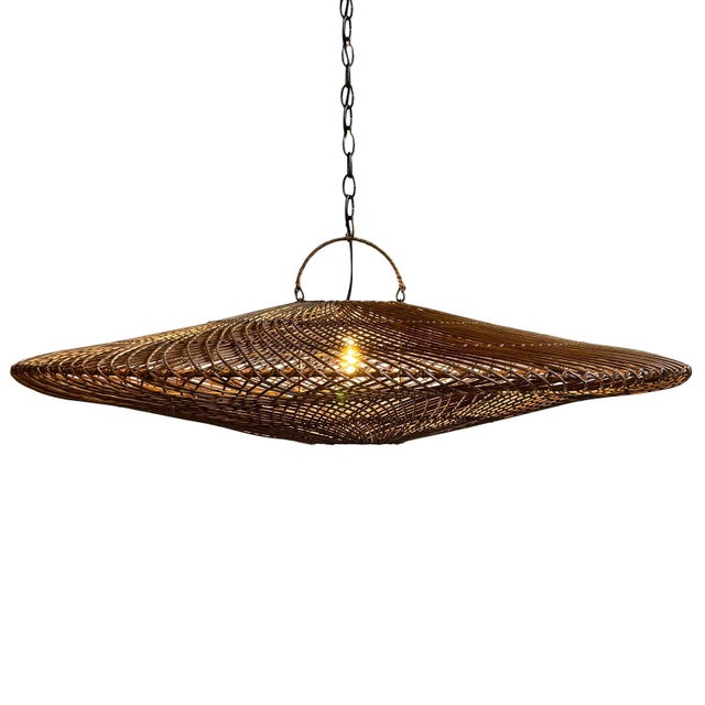 Hand woven coffee stain wicker discus design pendant light. Height measurement includes the 4" handle at top. Each may...