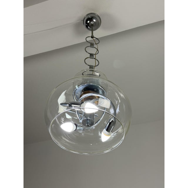 Three-light glass and steel chandelier, Made in Italy, 1970s Glass intact, good condition. Height 90 cm Diameter 40 cm Up...