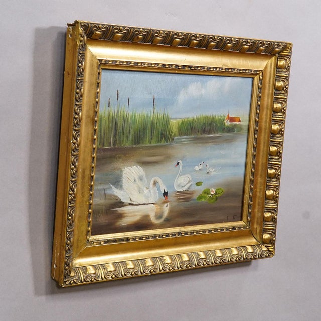 19th Century Biedermeier Painting with Swans on a Lake This antique oil painting, set in a wooden gilded frame, was...