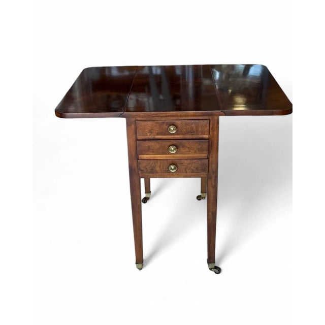 Drop leaf mahogany side table from the Aston Court Collection of Henredon. This rectangular Pembroke table has 2 drawers...