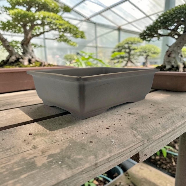 A mid-to-late twentieth-century Japanese rectangular bonsai pot in warm brown high-fired ceramic, designed in the...