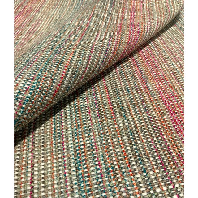 This modern woven fabric will add a pop of color to any room with a turquoise, pink, green, orange, off-white, and greige...