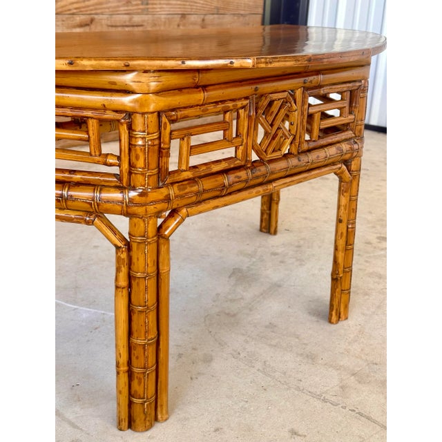 Introduce an element of refined elegance to your space with this Vintage Bamboo Chinese style demi-lune low profile center...