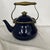 Cobalt blue and brass enamel tea pot. Nice squatty style. Measures 10” w x 7.5” d x 9.5” with handle up, 7” w/ handle down