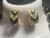 This vintage 1980s Trifari demi-parure features 18” necklace and earrings in a bold Art Deco revival aesthetic, pairing a...