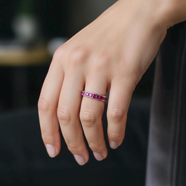 A breathtaking masterpiece of modern lapidary art, this vintage full eternity wedding band (circa 1990) is crafted in...