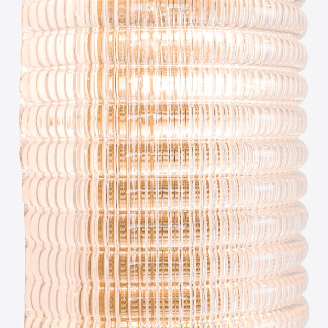 A sophisticated mid-century inspired glass wall light, available in 3 sizes. The waffle glass shade features neat,...